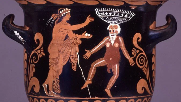 Cratere campanario a figure rosse da Paestum 360-340 a.C. In una scena della commedia greca, Dioniso è raffigurato con un attore comico che tiene in equilibrio un cesto sulla testa. L'attore è in costume tipico: pancia imbottita, fallo aggiunto e maschera barbuta.